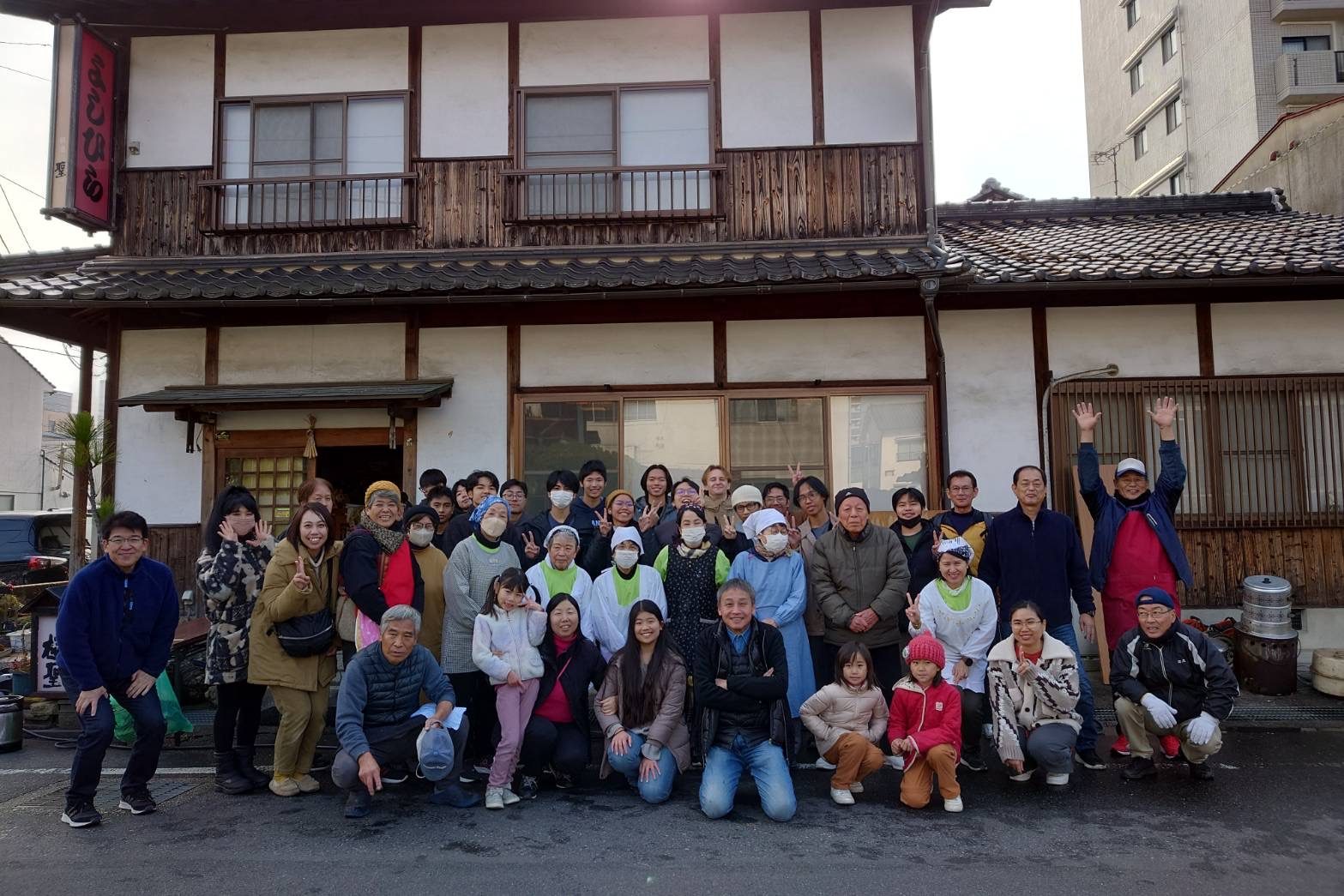 Everyone in front of the neighborhood mochi shop